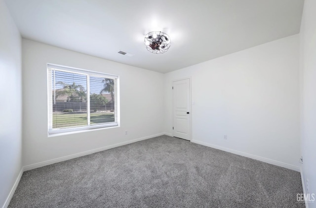 14211 Cedar Creek Ave, Bakersfield, CA 93314 - empty room featuring carpet floors and baseboards