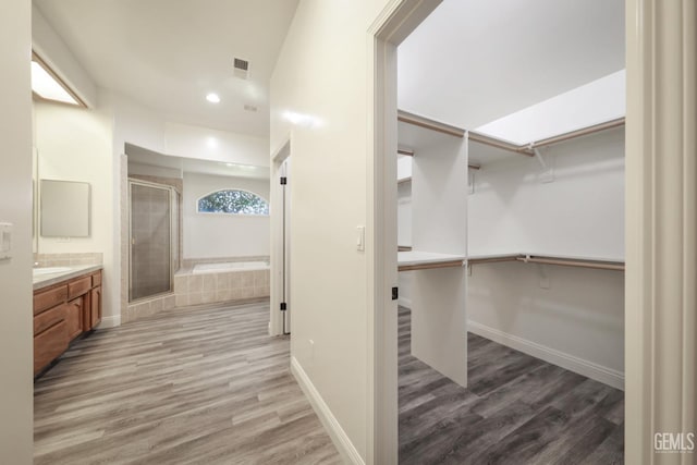 14211 Cedar Creek Ave, Bakersfield, CA 93314 - spacious closet with wood finished floors