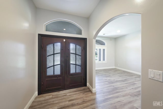 14211 Cedar Creek Ave, Bakersfield, CA 93314 - entrance foyer with arched walkways, wood finished floors, and french doors