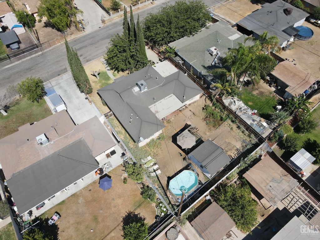 2613 Anza St, Bakersfield, CA 93305 - aerial view of property and surrounding area with nearby suburban area and a pool area