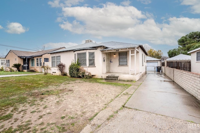 view of front of home featuring a garage and a front lawn