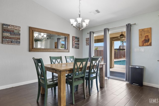 dining room featuring dark wood-style flooring, baseboards, a chandelier, and visible vents