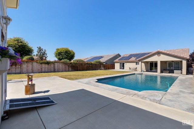 view of swimming pool with a fenced backyard, a fenced in pool, a patio, and a yard