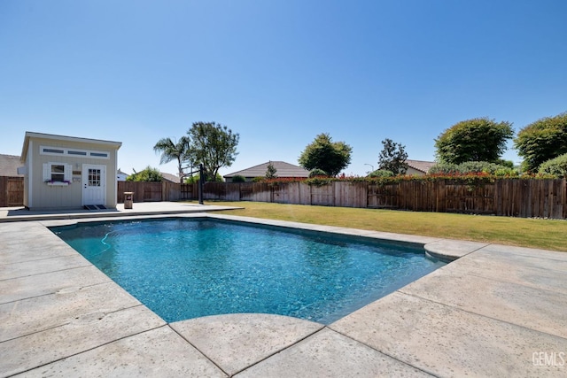 view of swimming pool featuring a yard, a patio, a fenced in pool, and a fenced backyard
