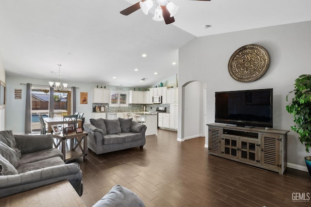 living area featuring dark wood-style flooring, baseboards, ceiling fan with notable chandelier, lofted ceiling, and recessed lighting