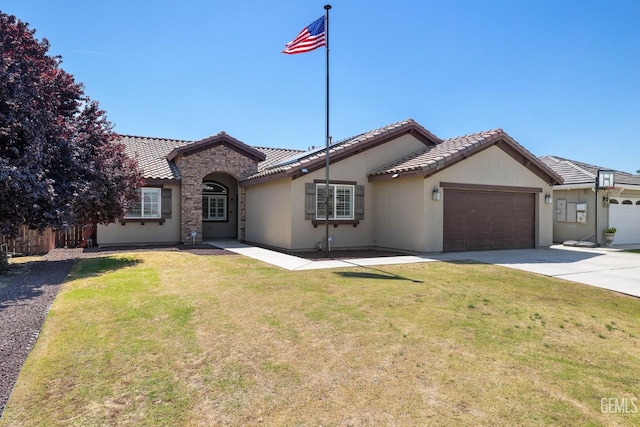 view of front facade featuring an attached garage, a tile roof, a front yard, and stucco siding