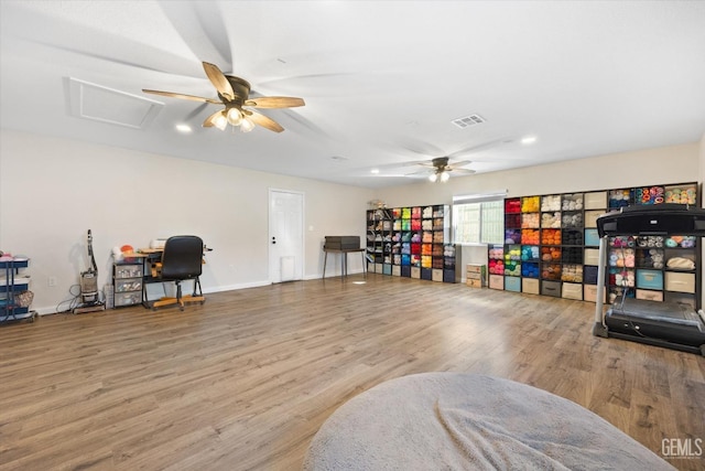workout room featuring a ceiling fan, wood finished floors, baseboards, and recessed lighting