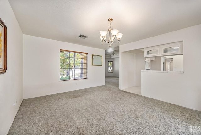 7310 Clifftop Way, Bakersfield, CA 93306 - empty room with a chandelier, light carpet, and ceiling fan