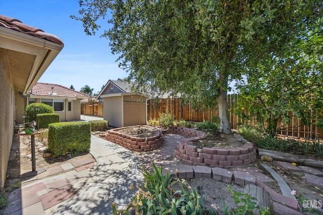 7310 Clifftop Way, Bakersfield, CA 93306 - fenced backyard with a patio and a storage unit