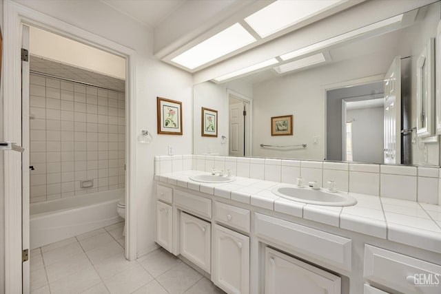 7310 Clifftop Way, Bakersfield, CA 93306 - full bath with double vanity, tile patterned floors, and bathtub / shower combination