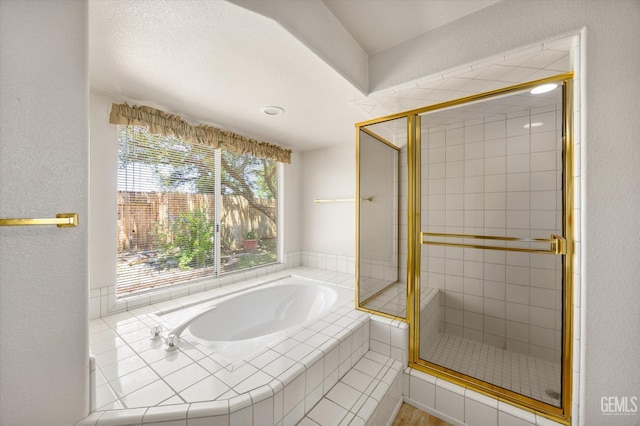 7310 Clifftop Way, Bakersfield, CA 93306 - full bath featuring a bath, a shower stall, and a textured wall
