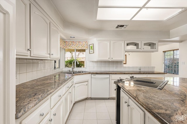 7310 Clifftop Way, Bakersfield, CA 93306 - kitchen with white dishwasher, white cabinetry, and tasteful backsplash