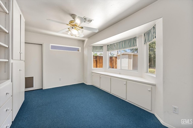7310 Clifftop Way, Bakersfield, CA 93306 - empty room featuring dark carpet and ceiling fan