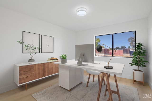 office featuring light wood-style flooring and baseboards