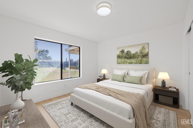 bedroom featuring wood finished floors