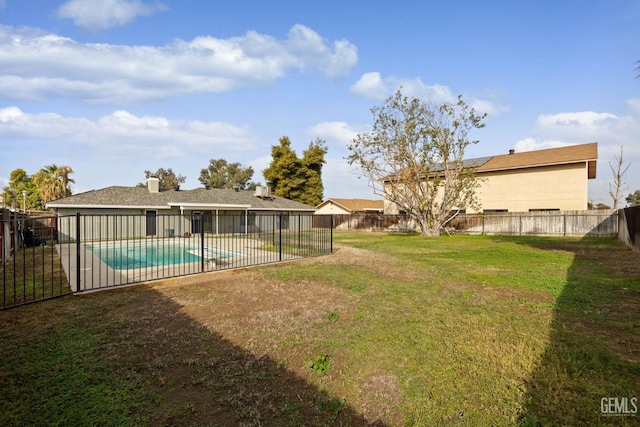 view of yard with a fenced backyard and a fenced in pool