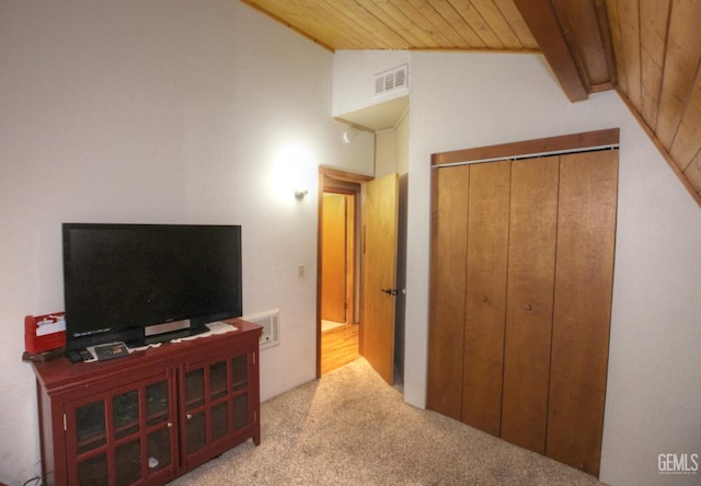 interior space featuring vaulted ceiling with beams