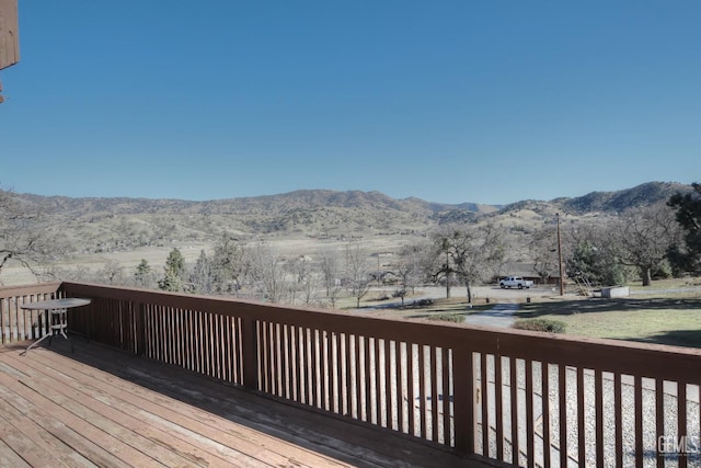 wooden deck featuring a mountain view