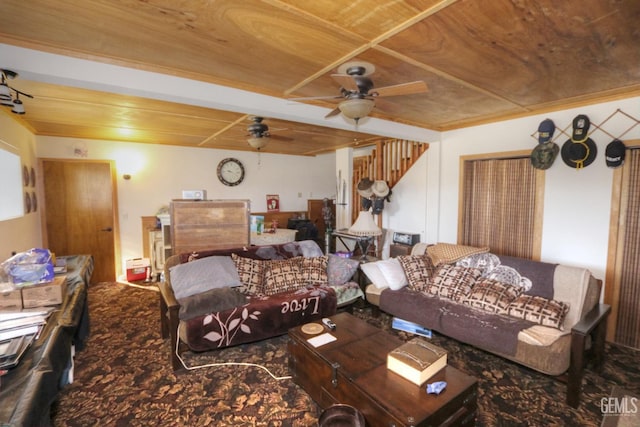 carpeted living room featuring wooden ceiling and ceiling fan