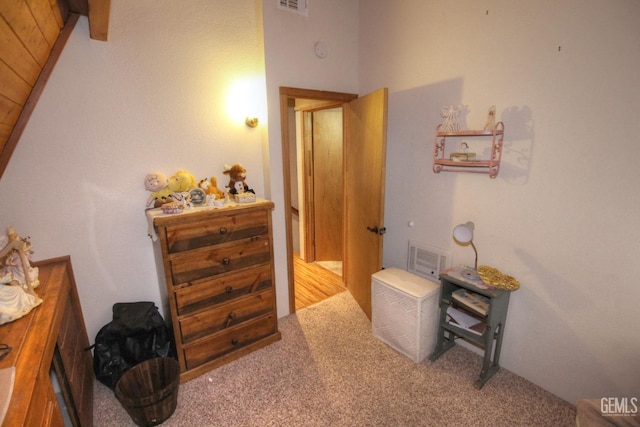 hallway with light colored carpet