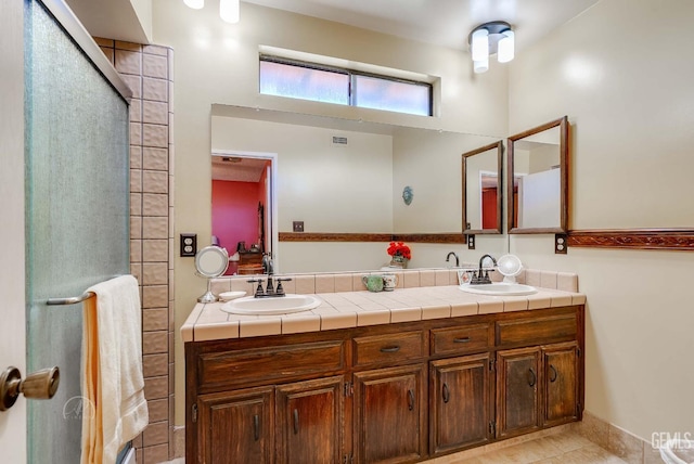 510 Sierra St, Taft, CA 93268 - full bathroom featuring double vanity, a shower with shower door, and tile patterned flooring