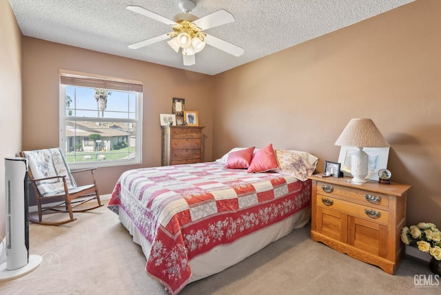 510 Sierra St, Taft, CA 93268 - bedroom with light colored carpet, a textured ceiling, and ceiling fan