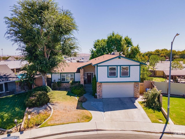 510 Sierra St, Taft, CA 93268 - tri-level home with stone siding, driveway, and an attached garage