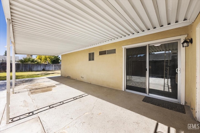 view of patio / terrace featuring fence