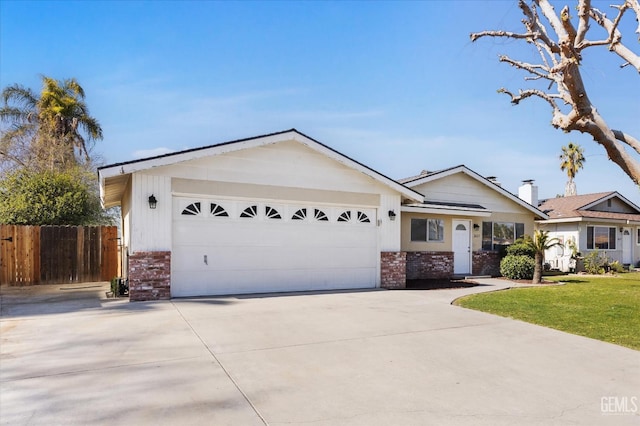 ranch-style home with an attached garage, brick siding, fence, concrete driveway, and a front yard