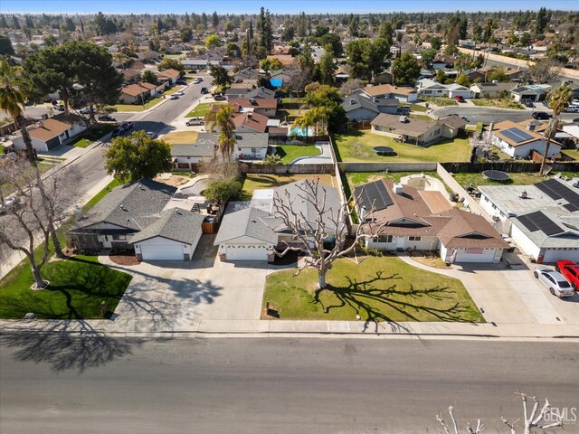 birds eye view of property with a residential view