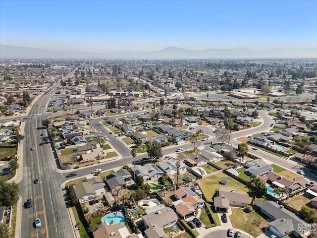 drone / aerial view with a residential view and a mountain view