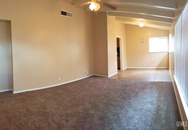 unfurnished room with lofted ceiling with beams, ceiling fan, and light tile patterned flooring