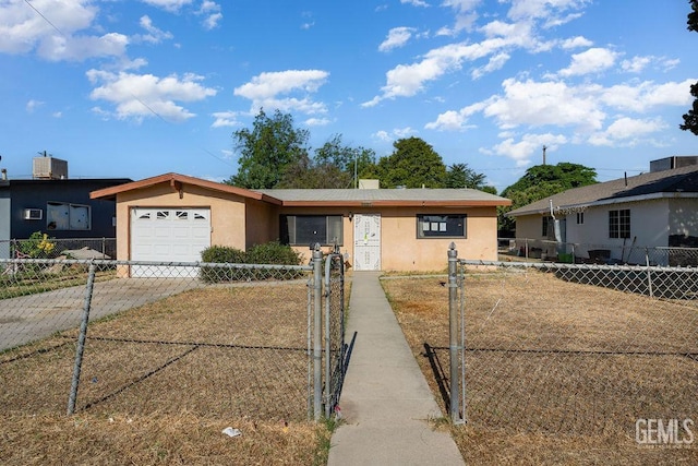 1857 Gaston St, Wasco, CA 93280 - single story home featuring concrete driveway, a garage, stucco siding, and a fenced front yard