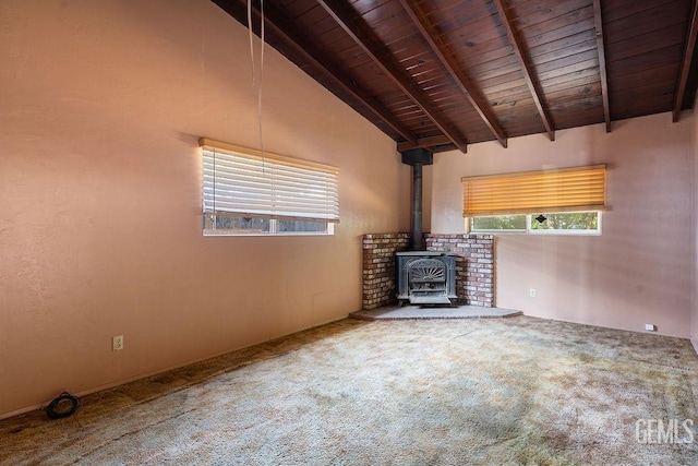 1857 Gaston St, Wasco, CA 93280 - unfurnished living room with carpet flooring, wood ceiling, and a wood stove