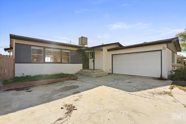 ranch-style home featuring a garage