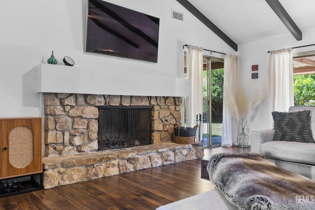 2513 Elm St, Bakersfield, CA 93301 - living area featuring beam ceiling, wood finished floors, a stone fireplace, and high vaulted ceiling