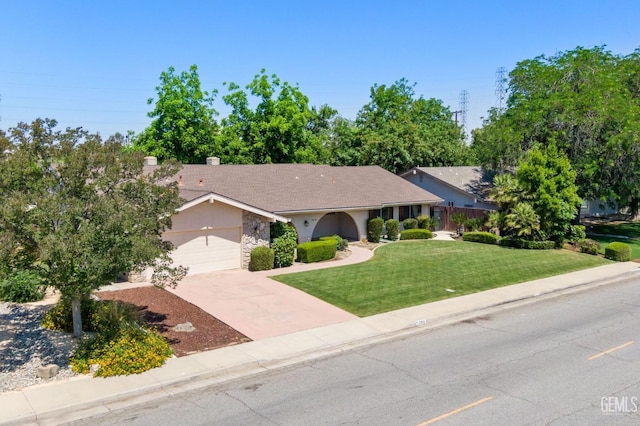 2513 Elm St, Bakersfield, CA 93301 - ranch-style home featuring a front lawn, an attached garage, stone siding, concrete driveway, and stucco siding