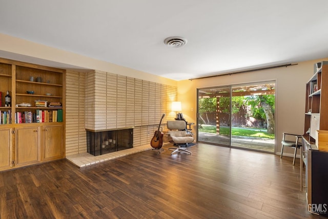 2513 Elm St, Bakersfield, CA 93301 - living area featuring a fireplace and wood finished floors