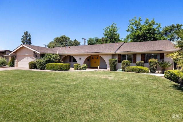 2513 Elm St, Bakersfield, CA 93301 - ranch-style home featuring an attached garage, a front lawn, and stucco siding