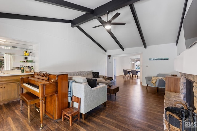 2513 Elm St, Bakersfield, CA 93301 - living room with a ceiling fan, dark wood finished floors, and bar area