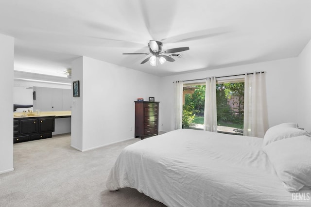 2513 Elm St, Bakersfield, CA 93301 - bedroom with light colored carpet, ensuite bath, baseboards, a ceiling fan, and a sink