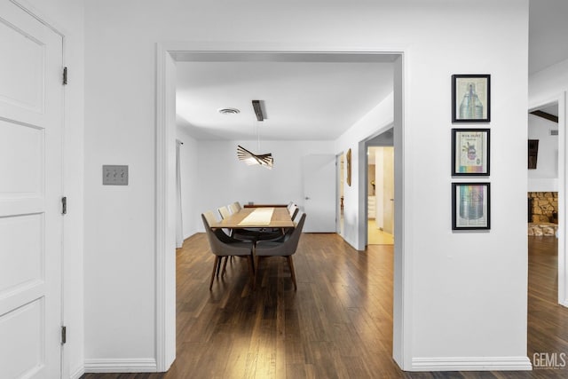 2513 Elm St, Bakersfield, CA 93301 - dining room with dark wood finished floors and baseboards