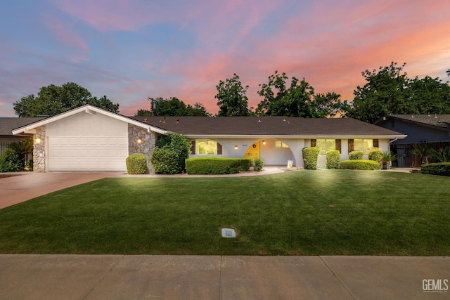 2513 Elm St, Bakersfield, CA 93301 - single story home featuring driveway, a front lawn, a garage, stone siding, and stucco siding