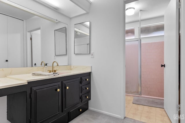 2513 Elm St, Bakersfield, CA 93301 - bathroom with a stall shower, vanity, baseboards, and tile patterned floors
