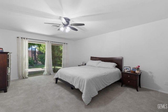 2513 Elm St, Bakersfield, CA 93301 - bedroom with light colored carpet, access to exterior, a ceiling fan, and baseboards