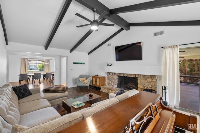 2513 Elm St, Bakersfield, CA 93301 - living area with ceiling fan, wood finished floors, and a fireplace