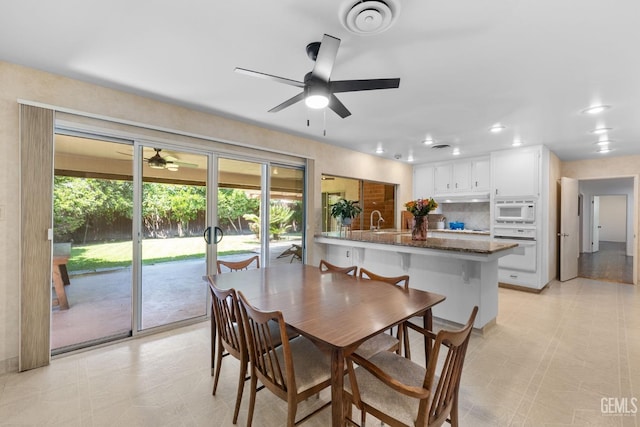 2513 Elm St, Bakersfield, CA 93301 - dining room with a ceiling fan, plenty of natural light, and recessed lighting