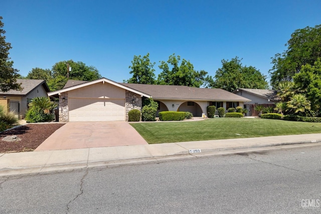 2513 Elm St, Bakersfield, CA 93301 - ranch-style house with stone siding, an attached garage, a front lawn, and driveway