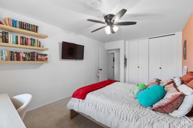 2513 Elm St, Bakersfield, CA 93301 - bedroom with carpet floors, a closet, a ceiling fan, and baseboards