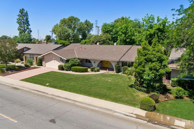 2513 Elm St, Bakersfield, CA 93301 - ranch-style house featuring driveway, a front lawn, an attached garage, and roof with shingles